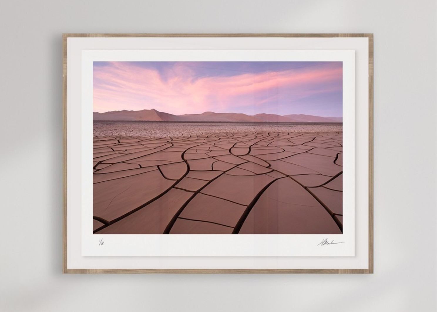 A desert photograph floated in a natural wood frame